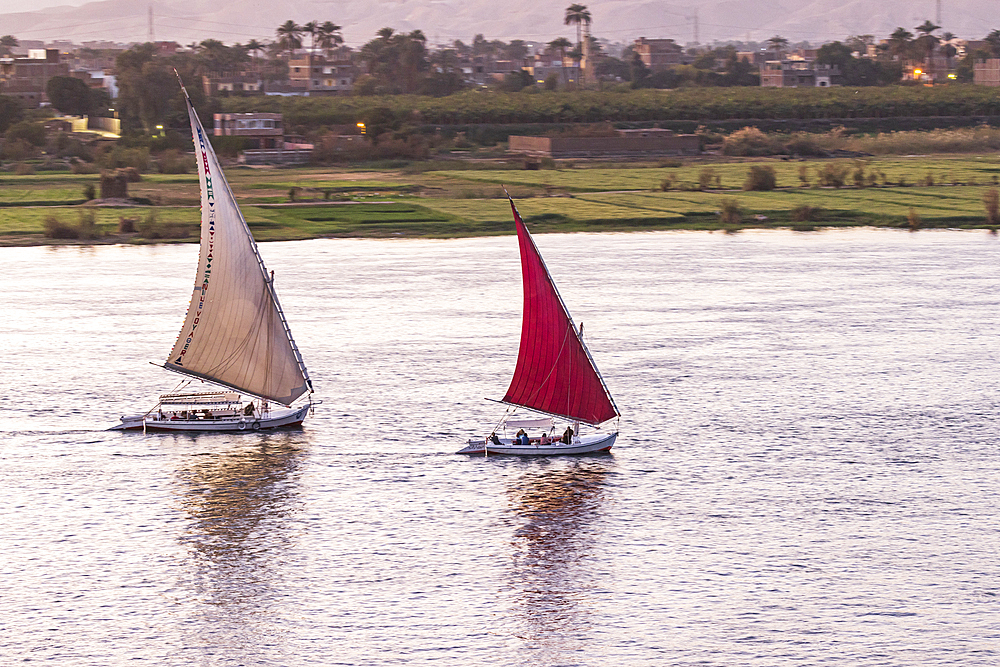 Edfu, Aswan, Egypt. February 25, 2022. Feluccas sailing on the Nile River in Edfu.