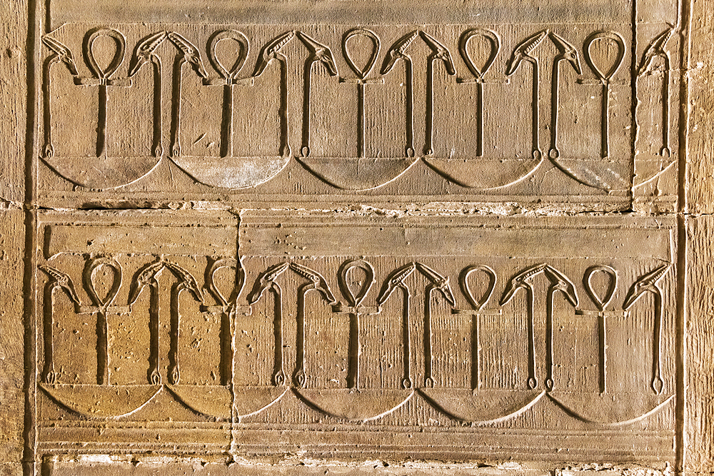 Edfu, Aswan, Egypt. February 25, 2022. Decorative pattern with ankhs in the Temple of Horus at Edfu.