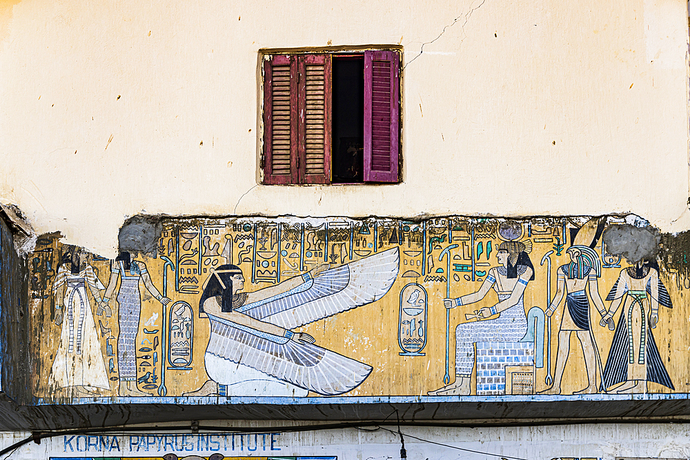 Thebes, Luxor, Egypt. February 26, 2022. Contemporary mural of ancient Egyptian art on a building in Luxor.