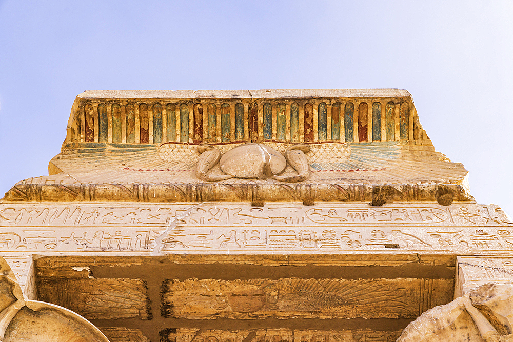 Kom Ombo, Aswan, Egypt. Upward view of a painted eave at the Kom Ombo temple.