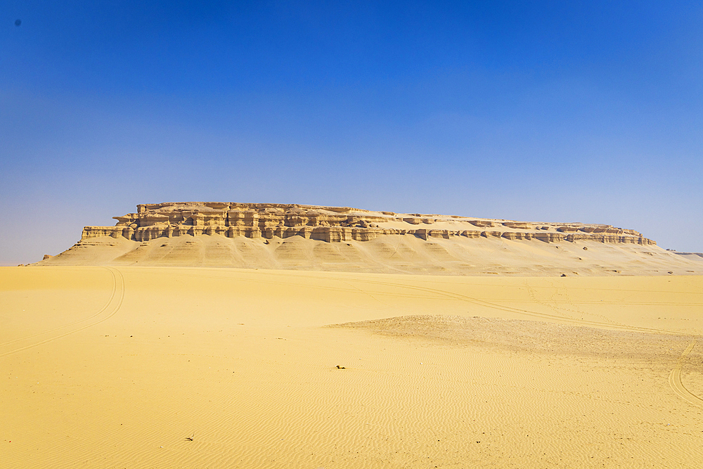 Wadi al Hitan, Faiyum, Egypt. Sandy desert and eroded cliffs.