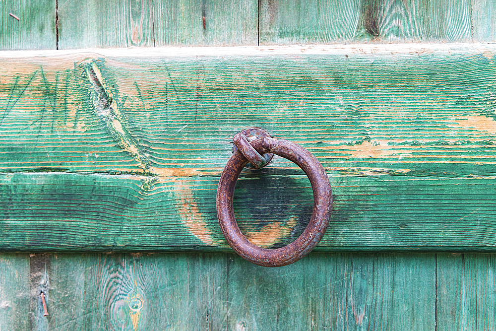 Faiyum, Egypt. Iron ring on a green painted wooden gate in the village of Faiyum.