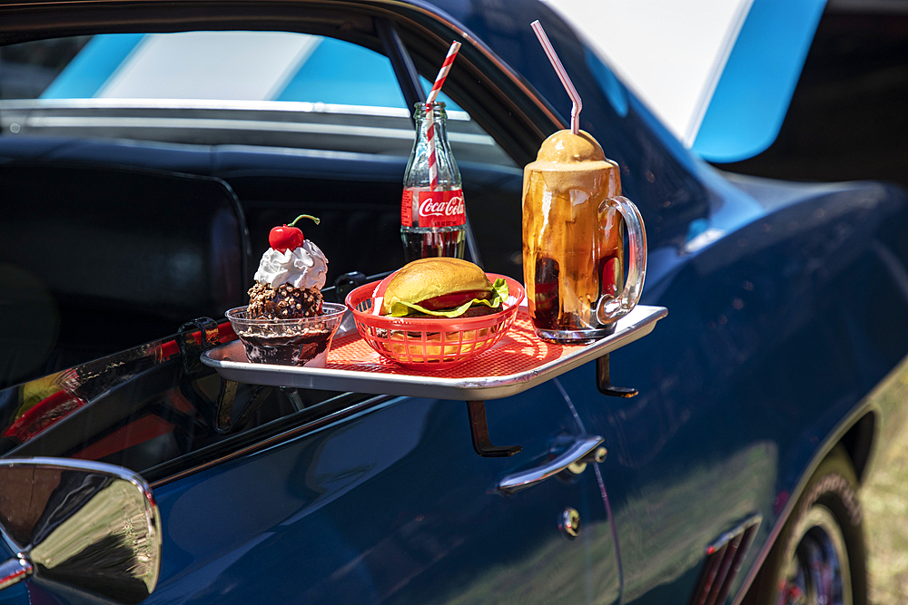 Marble Falls, Texas, USA. April 10, 2021. Automobile with a Drive-in food tray at a car show.