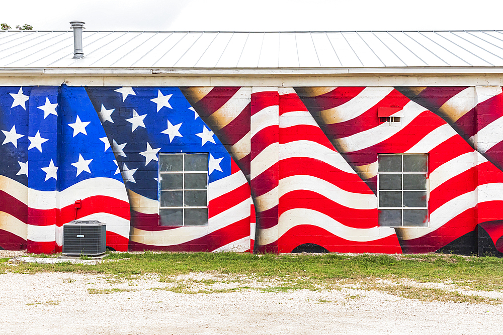 Bandera, Texas, USA. April 14, 2021. Mural of an American flag on a building in Texas.