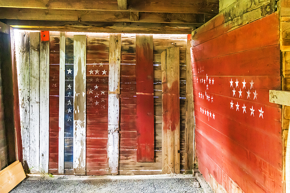 Latah, Washington, USA. May 24, 2021. Garage in an old barn decorated in red, white, and blue. Editorial Use Only