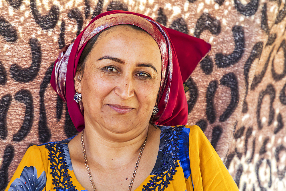 Momandiyon, Khatlon Province, Tajikistan. August 13, 2021. Tajik woman in a red head scarf. Editorial Use Only