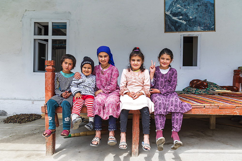 Margib, Sughd Province, Tajikistan. August 15, 2021. Children on a platform bed in a mountain village. Editorial Use Only