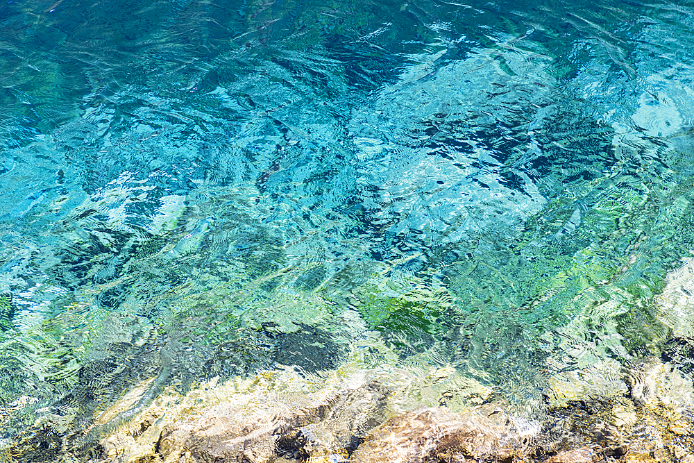 Haft Kul, Sughd Province, Tajikistan. Abstract patterns in the water of Nezhegon, Haft Kul, the Seven Lakes.