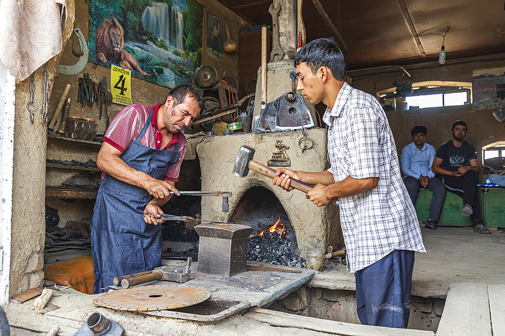 Istaravshan, Sughd Province, Tajikistan. August 19, 2021. Blacksmiths hand forging iron tools. Editorial Use Only