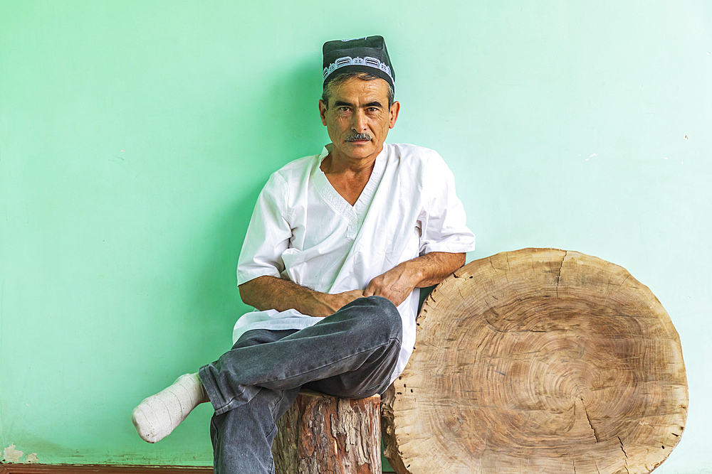 Istaravshan, Sughd Province, Tajikistan. August 19, 2021. Portrait of a craftsman who makes wooden combs. Editorial Use Only