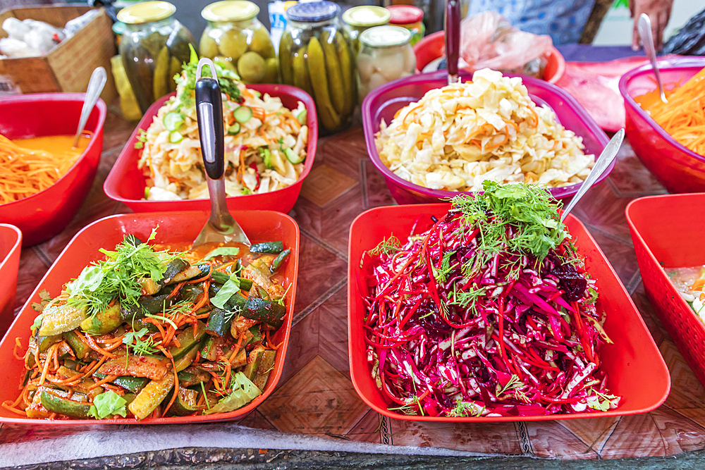 Khujand, Sughd Province, Tajikistan. Vegetable salads for sale at the Panjshanbe Bazaar in Khujand.