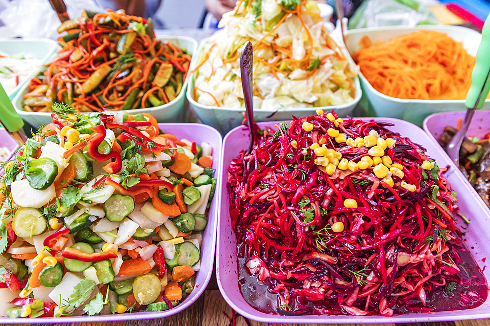 Khujand, Sughd Province, Tajikistan. Vegetable salads for sale at the Panjshanbe Bazaar in Khujand.