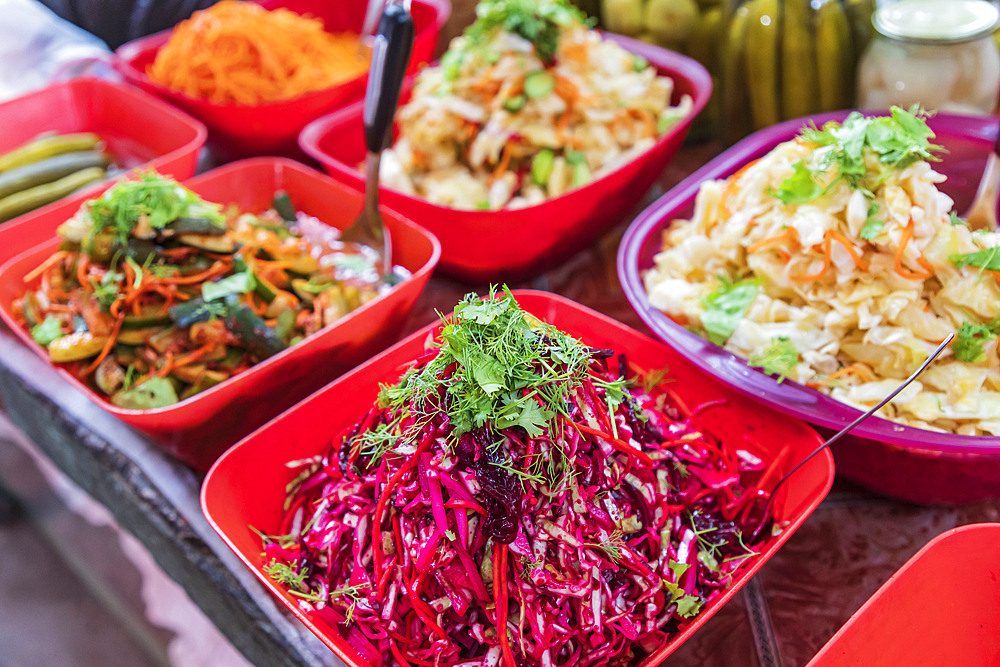 Khujand, Sughd Province, Tajikistan. Vegetable salads for sale at the Panjshanbe Bazaar in Khujand.