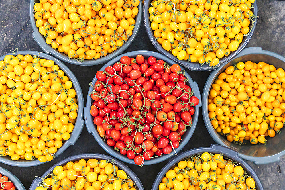 Khujand, Sughd Province, Tajikistan. Fresh yellow and red cherry tomatoes at the Panjshanbe Bazaar in Khujand.