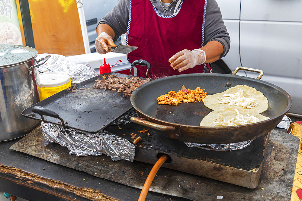 The Bronx, New York City, New York, USA. November 2, 2021. Tacos being cooked by a street vendor.