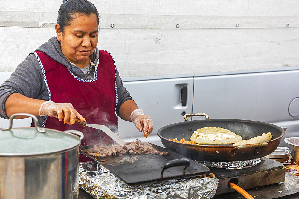 The Bronx, New York City, New York, USA. November 2, 2021. Tacos being cooked by a street vendor.