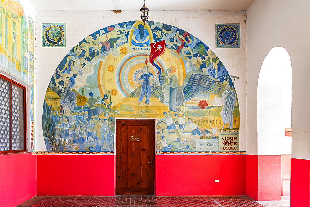 Todos Santos, Baja California Sur, Mexico. November 11, 2021. Socialist themed mural calling for vigor of the mind and the muscle, painted by school students in 1933.