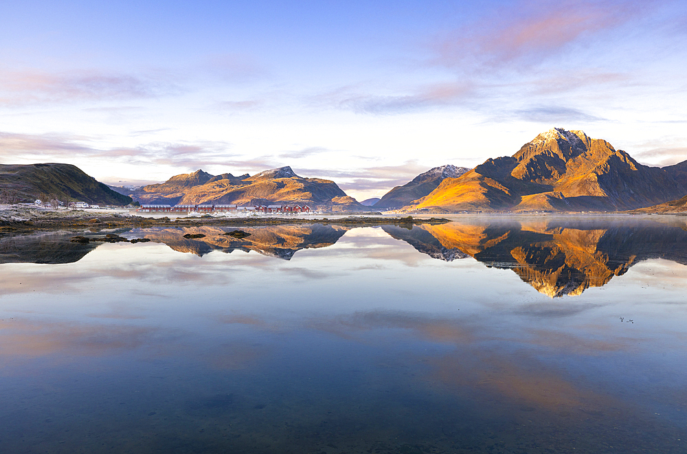 Mountains and rorbuer in a Fjord during sunset, Leknes, Vestvagoy, Nordland, Lofoten Islands, Norway, Scandinavia, Europe