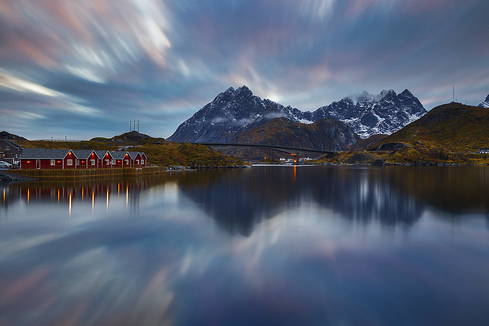 Norwegian fjord at blue hour with typical illuminated red cabins, Moskenesoya, Nordland, Lofoten, Norway, Scandinavia, Europe