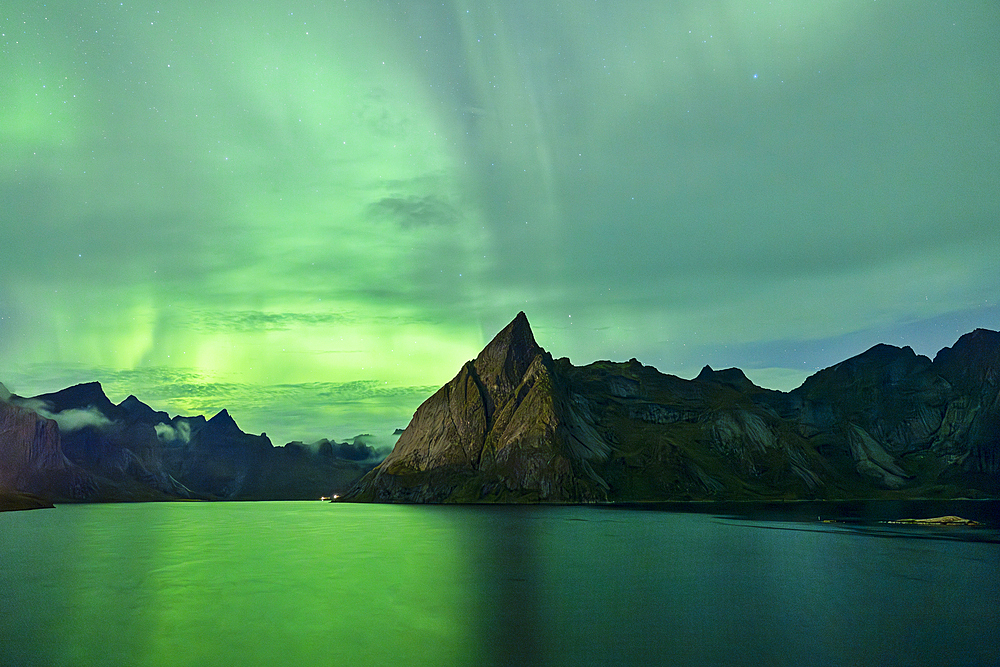 Northern Lights (Aurora Borealis) fill the sky over Reine Bay during an autumn night, Reine, Moskenesoya, Lofoten Islands, Nordland, Norway, Scandinavia, Europe