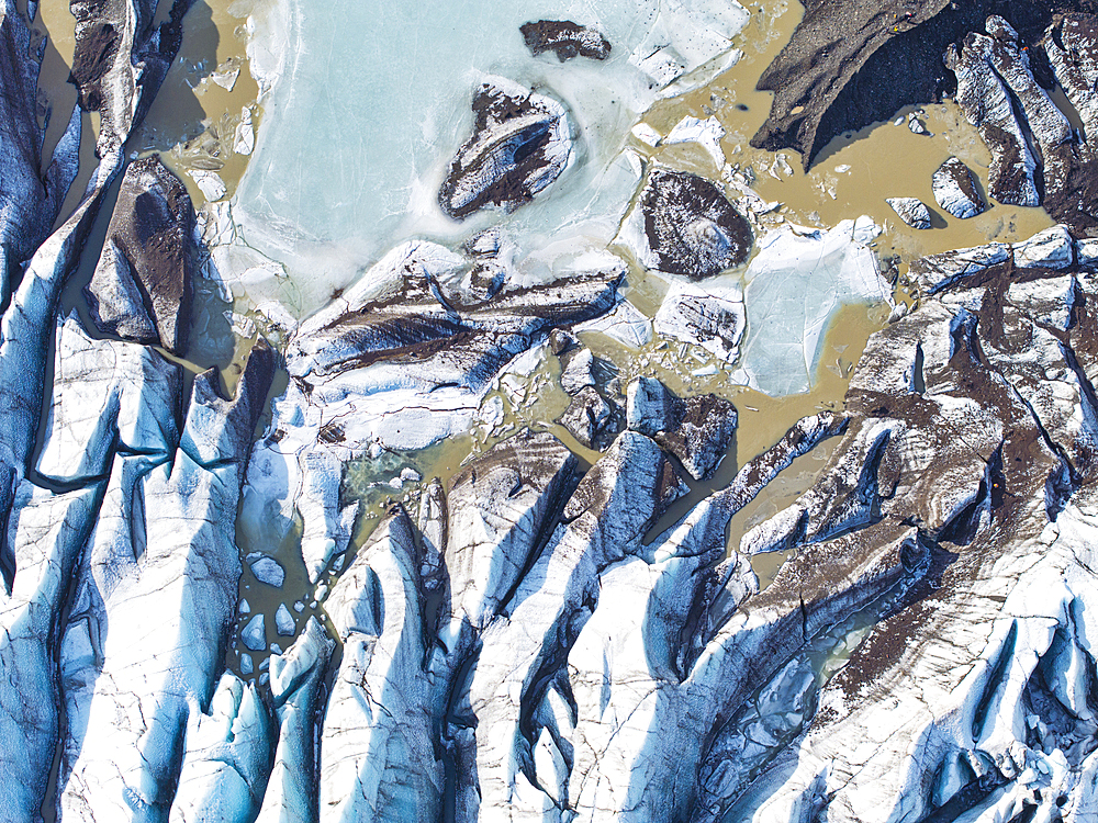 Aerial drone view of particular ice textures formed in the Svinafellsjokull glacier following global warming, Iceland, Polar Regions