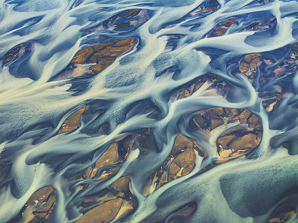 Aerial abstract view taken by drone of the textured river along the Icelandic southern coast, Iceland, Polar Regions