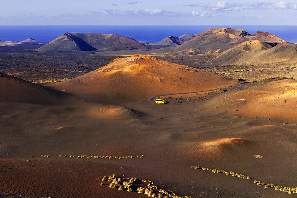 A bus in the middle of Timanfaya National Park, Yaiza, Tinajo, Las Palmas, Lanzarote, Canary Islands, Spain, Atlantic, Europe