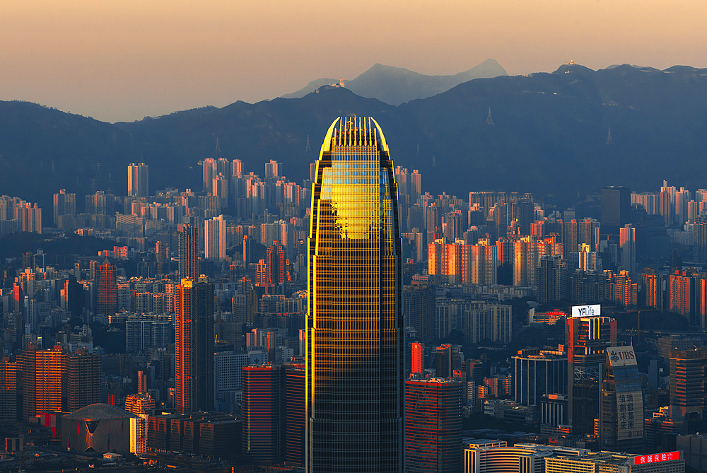 Elevated view of Hong Kong cityscape viewed from Lugard road during sunrise, The Peak, Hong Kong, China, Asia