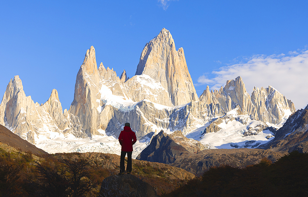 A tourist observes Fitz Roy mountain during sunrise, El Chalten, Parque Nacional Los Glaciares, Santa Cruz, Patagonia Argentina, Argentina, South America