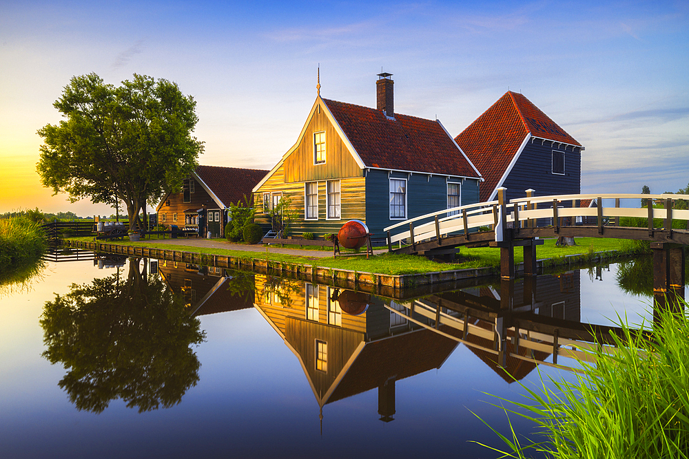 Zaanse Schans house during sunset in summer with reflections, Zaanstad, Zaandam, Netherlands, North Holland, Western Europe