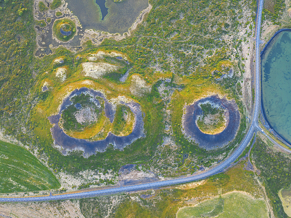 Aerial vertical view of old volcano and asphalt road, near to Myvatn lake on a summer day, Iceland, Polar Regions