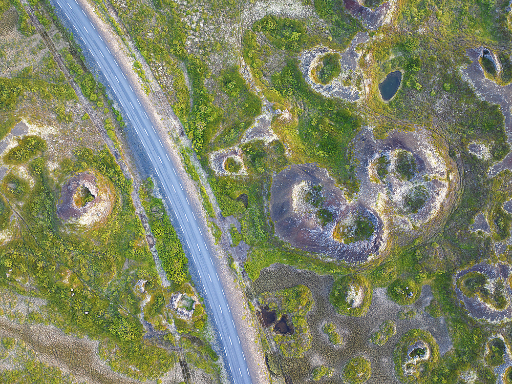 Aerial vertical view of old volcano and asphalt road, near to Myvatn lake on a summer day, Iceland, Polar Regions