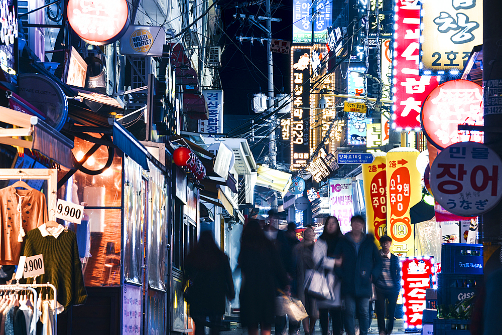 A bustling street scene at night in in Seoul's student district, Seoul, South Korea, Asia