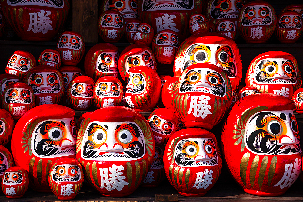 Frames filled with red daruma figures lucky charm of Shintoism .Katsuō-ji Temple in the Minoh National Park, Osaka, Kansai, Japan