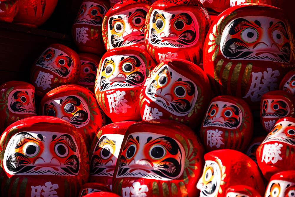 Frames filled with red daruma figures lucky charm of Shintoism .Katsuō-ji Temple in the Minoh National Park, Osaka, Kansai, Japan