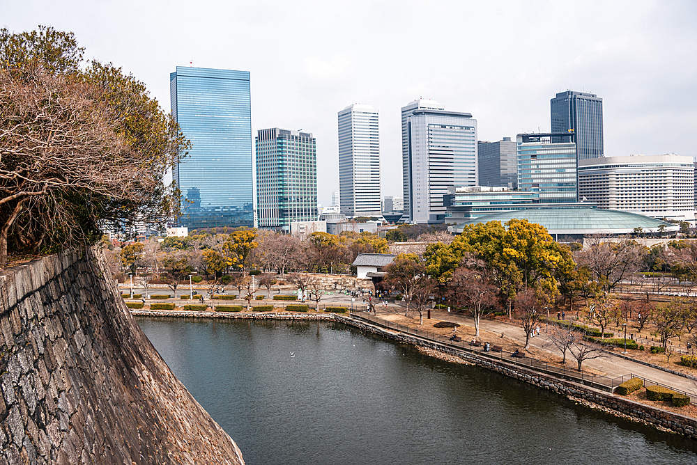 Overlooking the caste moat in front of the skyline of Osaka Business Park. Osaka Castle, Osaka, Kansai, Japan