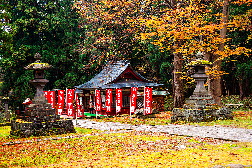 View of a Japanese temple, stone lanterns in an autumnal forest, The Mount Iwaki Shrine, near Hirosaki, North Honshu, Japan, Asia