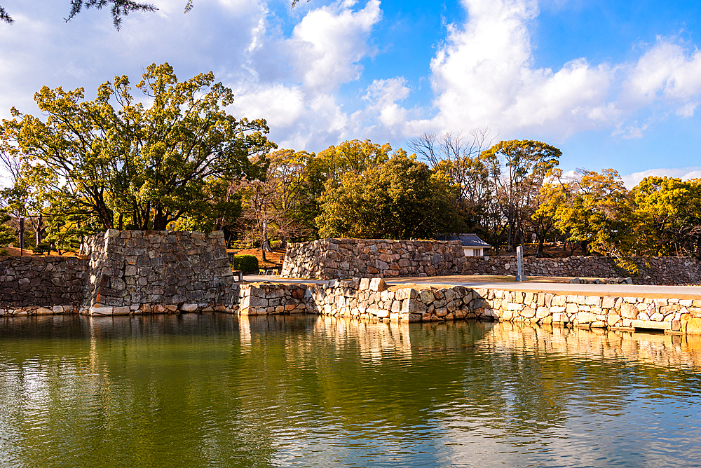 old walls of the castle fortification. Water in the castle moat of Hiroshima samurai castle. Japan