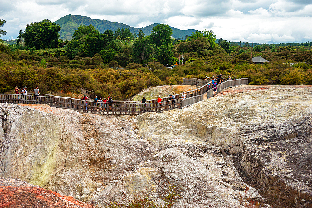 Walking paths through a volcano landscape in Waiotapu Thermal Wonderland, North Island, New Zealand
