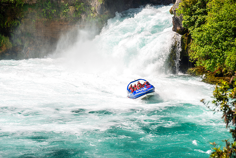 Huka falls near lake Taupo. Turquoise water white water rafting at the waterfall in Waikato River. New Zealand.