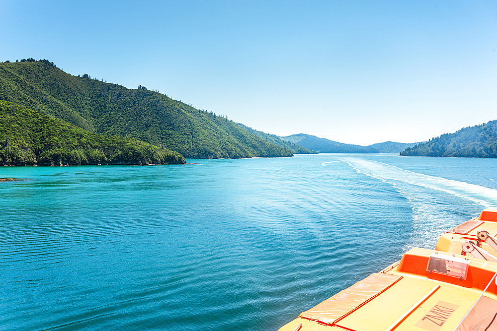 View from ferry cruising through Queen Charlotte Sound Marlborough Sounds New Zealand on a sunny day