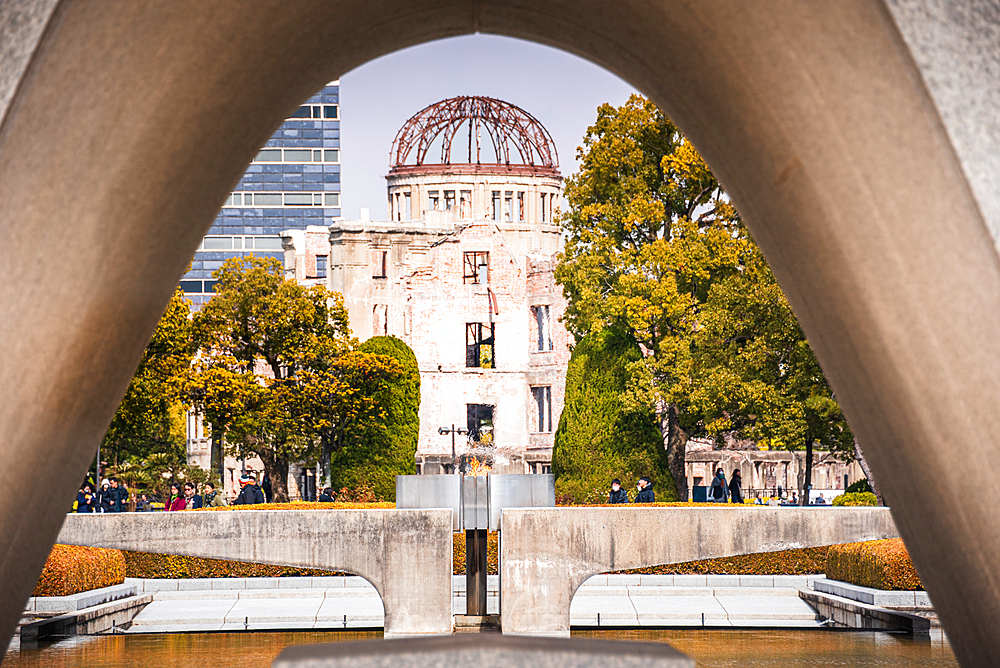Hiroshima Peace Memorial Cenotaph Framing the Atomic Bomb Dome in Peace Memorial Park, Hiroshima, Japan