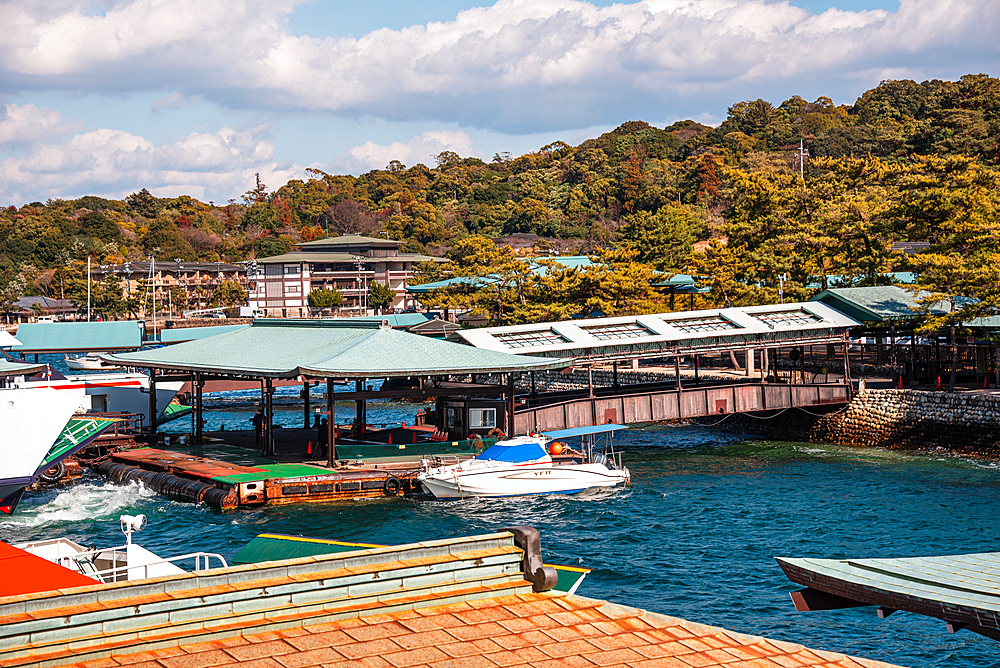 Miyajima Island Ferry Terminal with Moored Boats and Forested Hills in the Background, Japan