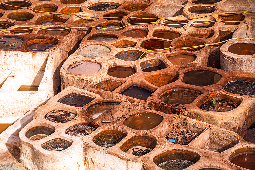 Top View of Circular Brown Dyeing Vats in the Historic Chouara Tannery, Fes, Morocco