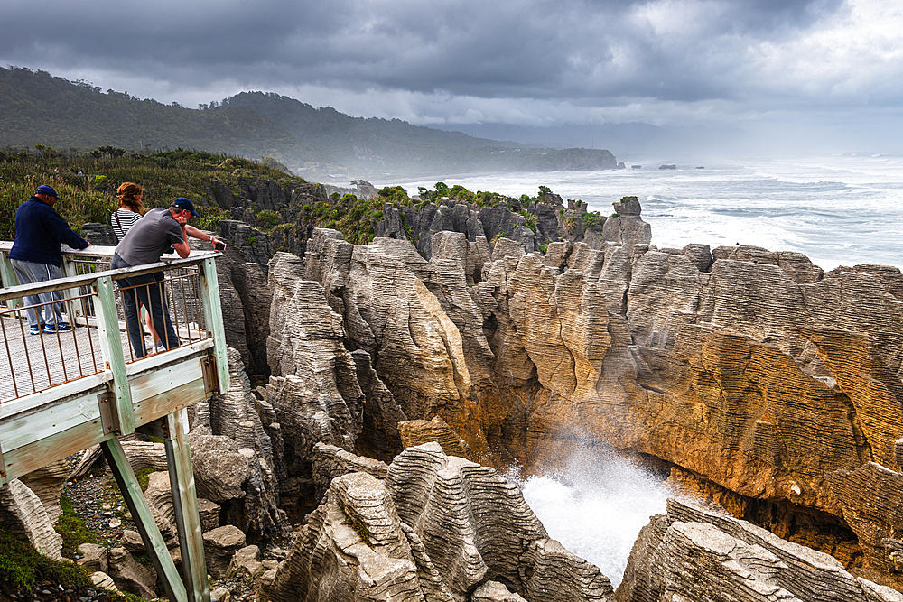 Crowd Watching Sea Spray Erupting from Blowhole at Pancake Rocks, Punakaiki, Paparoa National Park, New Zealand