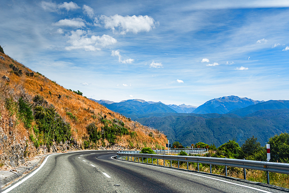 Sweeping Bend on Mountain Road Overlooking Valley and Peaks, South Island Landscape, New Zealand