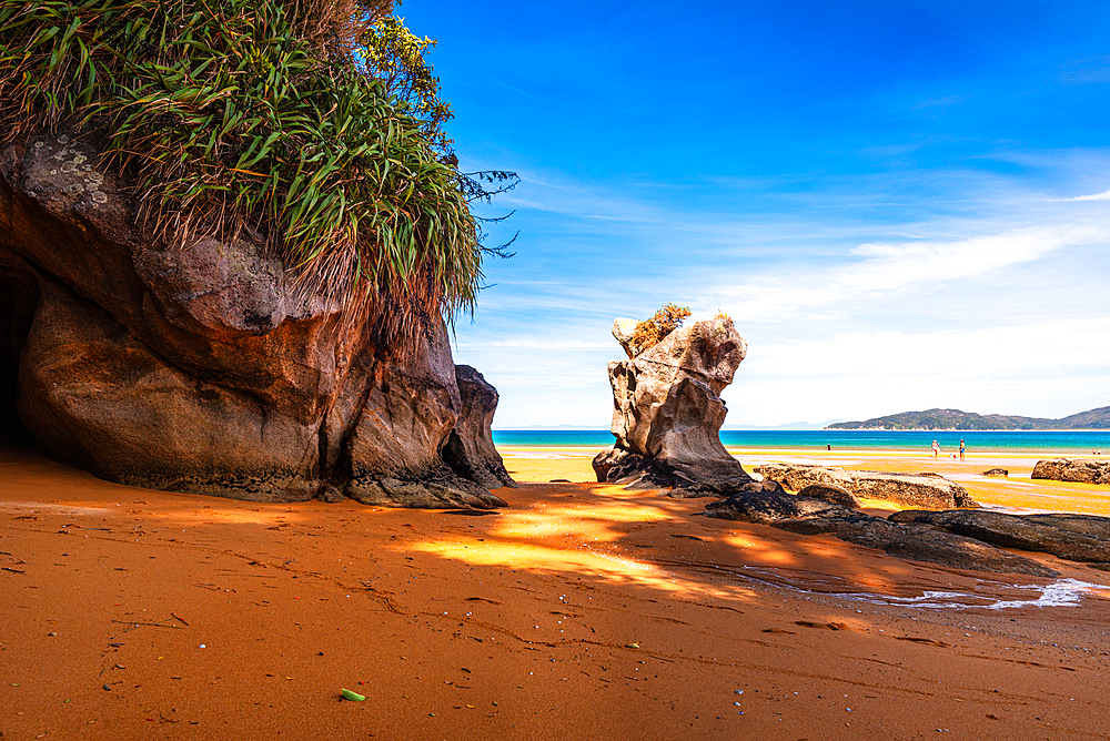 Scenic Rock Stack on Bright Orange Beach at Low Tide, Abel Tasman Coast, New Zealand