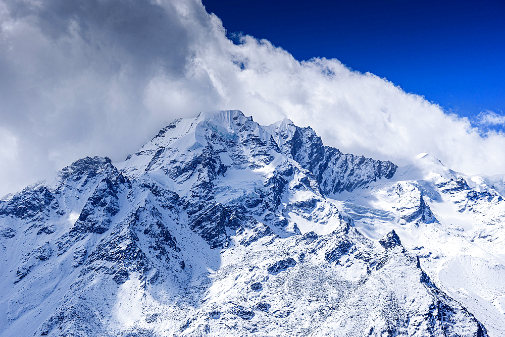 Sharp Snow-Covered Peaks of the Langtang Range Seen from Kyanjin Ri Summit, Featuring the Prominent Massif of Langtang Lirung