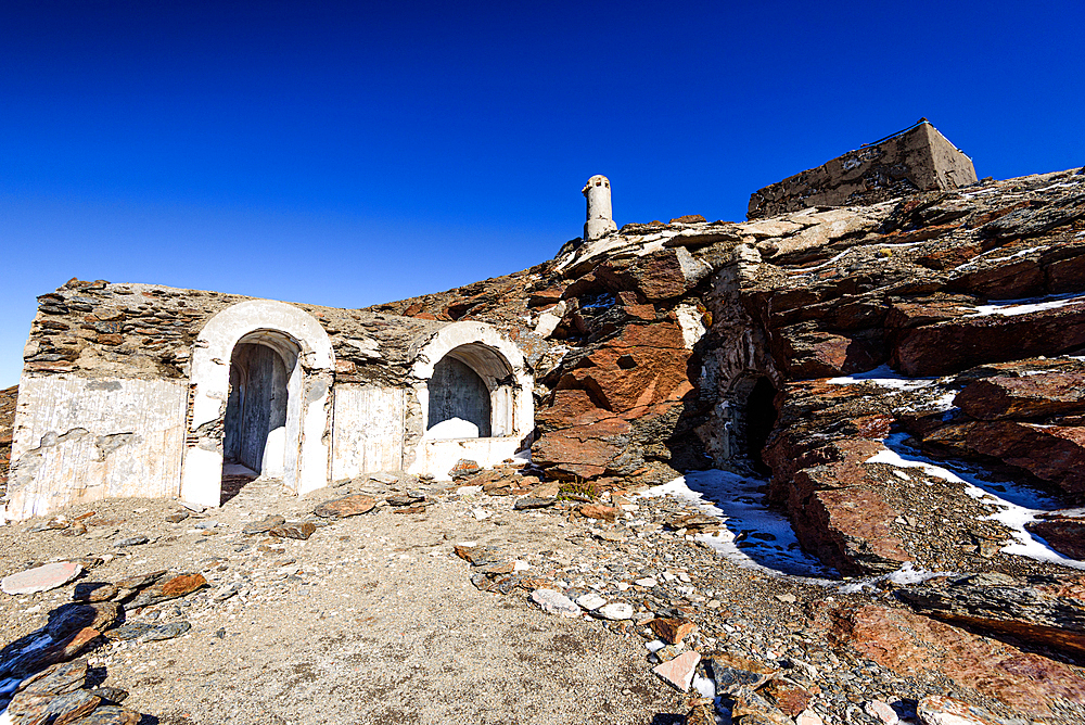 Abandoned stone refuge from the Spanish Civil War era near Pico de la veleta, Sierra Nevada National Park, Andalusia, Spain. Historic military ruins high in the mountains.