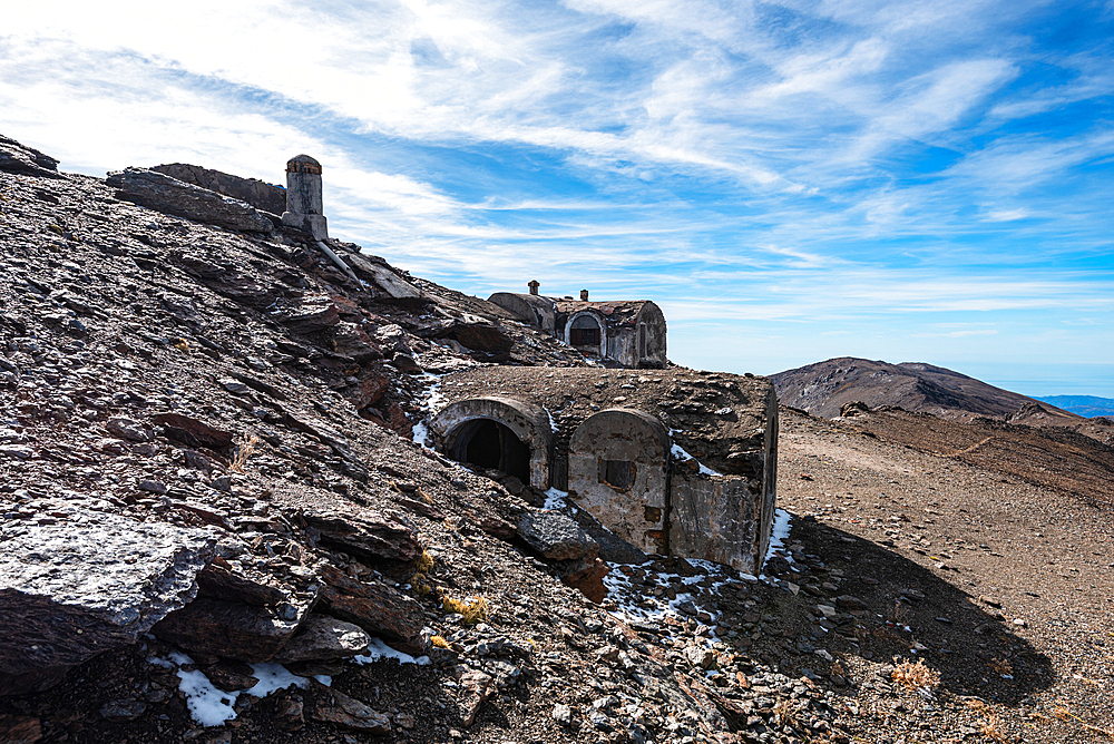 Ruins of a stone refuge and civil war mountain shelter high in the Sierra Nevada mountains of Andalusia, Spain.